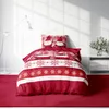 A Christmas-themed duvet cover and pillow set displayed on a bed. Produktbild-Vorschau