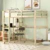 A loft bed with a desk and shelves, set up in a room with light green walls and a patterned rug. Produktbild-Vorschau