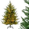 A pre-lit artificial Christmas tree on a white background, with a close-up of another Christmas tree branch on the right. Produktbild-Vorschau