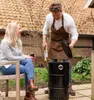 A couple is enjoying a barbecue in their backyard. Produktbild-Vorschau