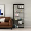 A modern living room scene featuring a brown leather sofa and a black metal bookshelf filled with books and decorative items. Voir les images du produit
