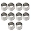 A group of metal washers or spacers arranged in rows on a white background. Podgląd zdjęcia produktu