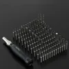 A set of precision screwdrivers and bits arranged on a black surface. Voir les images du produit