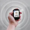 A hand holding a GPS cycling computer with a map-like background. Produktbild-Vorschau