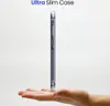 A transparent phone case is held on a person's palm, showcasing its slim profile. Produktbild-Vorschau