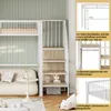 A bunk bed with stairs and storage in a room setting. Podgląd zdjęcia produktu