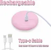 A pink rechargeable device with a charging cable connected, and a separate charging cable shown below. Produktbild-Vorschau