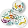 Three plates with koi fish and coral designs are arranged on a white background. Podgląd zdjęcia produktu