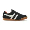 A side view of a black Gola Harrier sneaker with white stripes and a gum sole. Produktbild-Vorschau