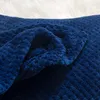 A close-up of a soft, textured blue blanket. Podgląd zdjęcia produktu