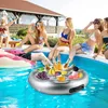 People relaxing by a pool with a floating drink tray. Náhled obrázku produktu