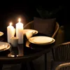 A table set for a meal with candles lit, suggesting an outdoor evening setting. Produktbild-Vorschau