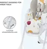 A close-up of a colorful baby high chair with text overlays highlighting features. Podgląd zdjęcia produktu