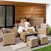 A couple relaxing on a patio with a rattan lounge set. Produktbild-Vorschau
