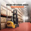 A forklift is parked on red interlocking floor tiles in a warehouse filled with shelves of boxes. Náhled obrázku produktu