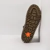 The sole of a shoe is shown leaning against a white wall. Produktbild-Vorschau