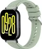 A smartwatch with a light green strap is shown against a white background. Náhled obrázku produktu