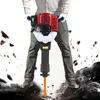 A person is using a demolition hammer to break rocks. Náhled obrázku produktu