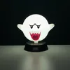A white Boo ghost lamp from Super Mario is displayed on a black base against a black background. Anteprima dell’immagine prodotto