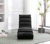 A modern living room with a dark gray chaise lounge on a green patterned rug, near a large window with a potted plant. Náhled obrázku produktu