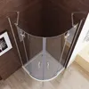 A corner shower enclosure with glass doors and silver handles, set against a dark wood paneled wall and light wood floor. Produktbild-Vorschau