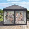 Four people are sitting around a table under a gray canopy tent with mesh sides, on a wooden deck. Podgląd zdjęcia produktu