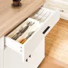 A close-up view of an open kitchen drawer containing cutlery in a tray, with a striped cloth folded behind it. Produktbild-Vorschau