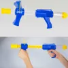 Two images showing a toy gun. The top image shows the gun from the front, with a 360-degree rotation indicator. The bottom image shows two hands holding the gun, demonstrating its use. Náhled obrázku produktu