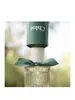 A close-up shot of a Chloé perfume bottle with a green ribbon tied around its neck, set against a blurred green and white background. Náhled obrázku produktu