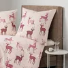 A close-up view of a bed with bedding featuring a deer pattern, next to a small side table. Produktbild-Vorschau