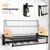 A black folding wall-mounted shelf with hooks and a towel bar, shown against a marble-patterned wall. The image includes diagrams illustrating the 90-degree folding mechanism and the text '90° Folding Design Easy to store and save space'. Náhľad obrázku produktu