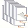 A stack of silver-bordered photo frames with one frame being peeled back by hands. Náhľad obrázku produktu