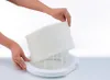Hands are shown assembling a white humidifier filter into a white base. Produktbild-Vorschau