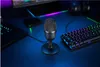 A gaming setup with a microphone, keyboard, and laptop on a desk. Podgląd zdjęcia produktu