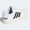 A side view of a white Adidas sneaker with black stripes. Anteprima dell’immagine prodotto