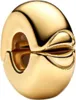 A close-up studio shot of a gold charm clip. Podgląd zdjęcia produktu