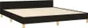 A black fabric bed frame with a wooden slatted base and four wooden legs, shown from a diagonal angle against a white background. Náhled obrázku produktu
