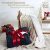 A cozy scene with blankets, gifts, and Christmas decorations. Produktbild-Vorschau