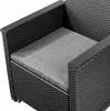 Close-up view of a section of a black rattan armchair with a grey cushion. Náhled obrázku produktu