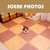 A room scene with puzzle mats on the floor, a stuffed animal, and furniture in the background. Produktbild-Vorschau