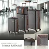 A collection of luggage in an airport terminal. Náhled obrázku produktu