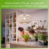 A woman and a child are looking at plants on a kitchen counter, with a pendant lamp overhead. Produktbild-Vorschau