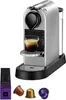 A Nespresso Krups CitiZ coffee machine with a cup of espresso and coffee capsules. Podgląd zdjęcia produktu