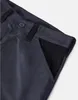 A close-up view of the pocket and waistband of a pair of shorts. Produktbild-Vorschau