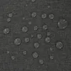A close-up view of a dark gray fabric with water droplets on it. Produktbild-Vorschau