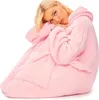 A woman wearing a pink hoodie blanket. Produktbild-Vorschau