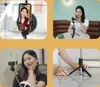Collage of a woman using a selfie stick and tripod for her phone in various settings. Voir les images du produit
