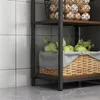 A close-up view of a shelf unit with a basket of green apples and a basket of eggs. Náhled obrázku produktu
