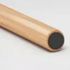A close-up view of the bottom of a wooden rod with a dark gray rubber stopper. Podgląd zdjęcia produktu