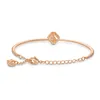 A rose gold bracelet with a clover charm and small crystals. Anteprima dell’immagine prodotto